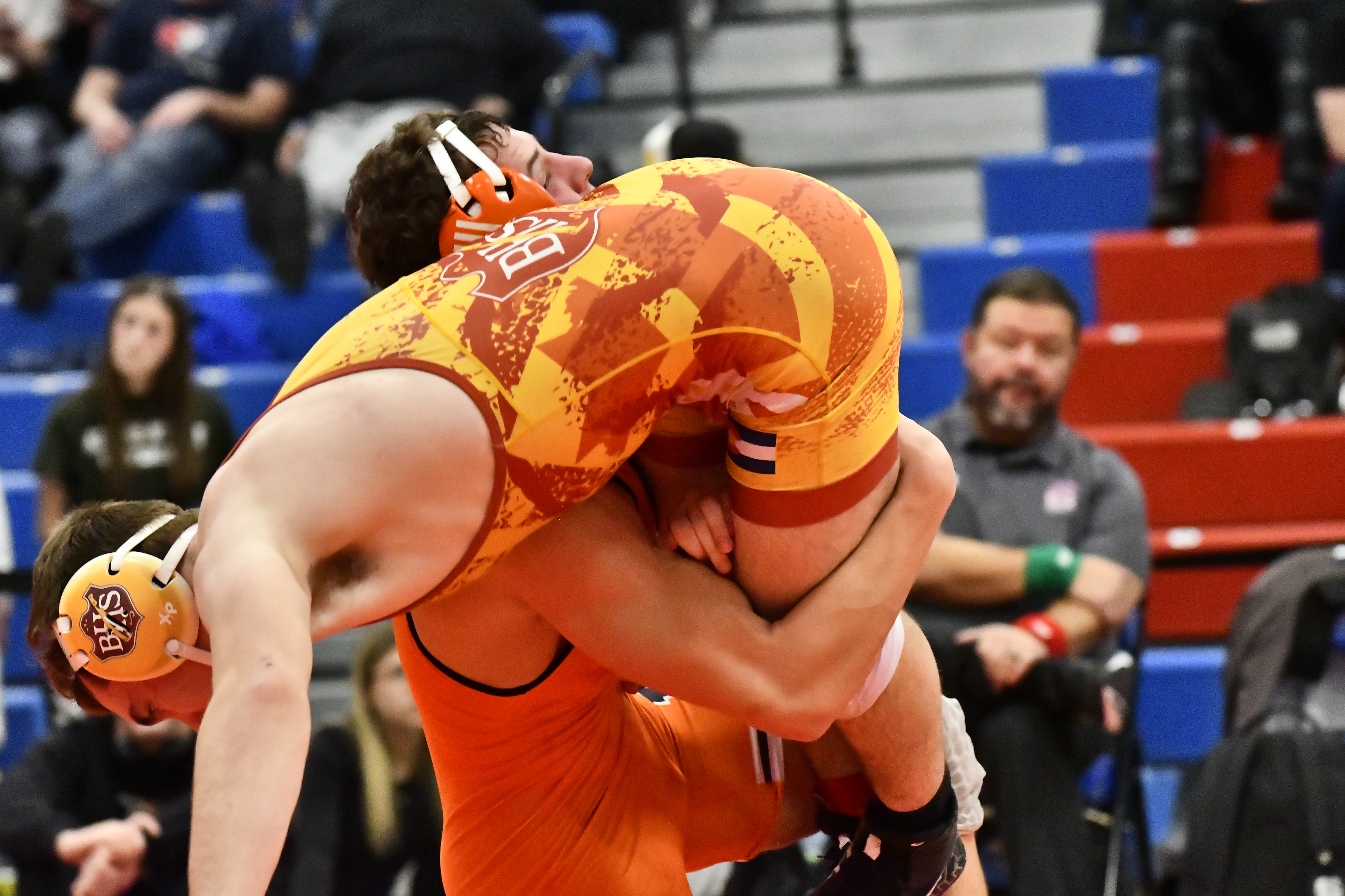 Erie's Tyler Muir wrestles against Brush's Austin Ley during the...