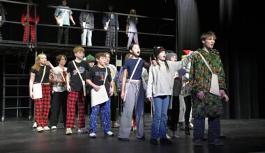 students perform onstage