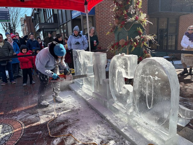 Ice sculptor Gabriella Santoro of Ice Sculpture Philly carves out DELCO by the clocktower on State Street on Jan. 25, 2025, during the annual Ice on State celebration in Media. (KATHLEEN E. CAREY - DAILY TIMES)