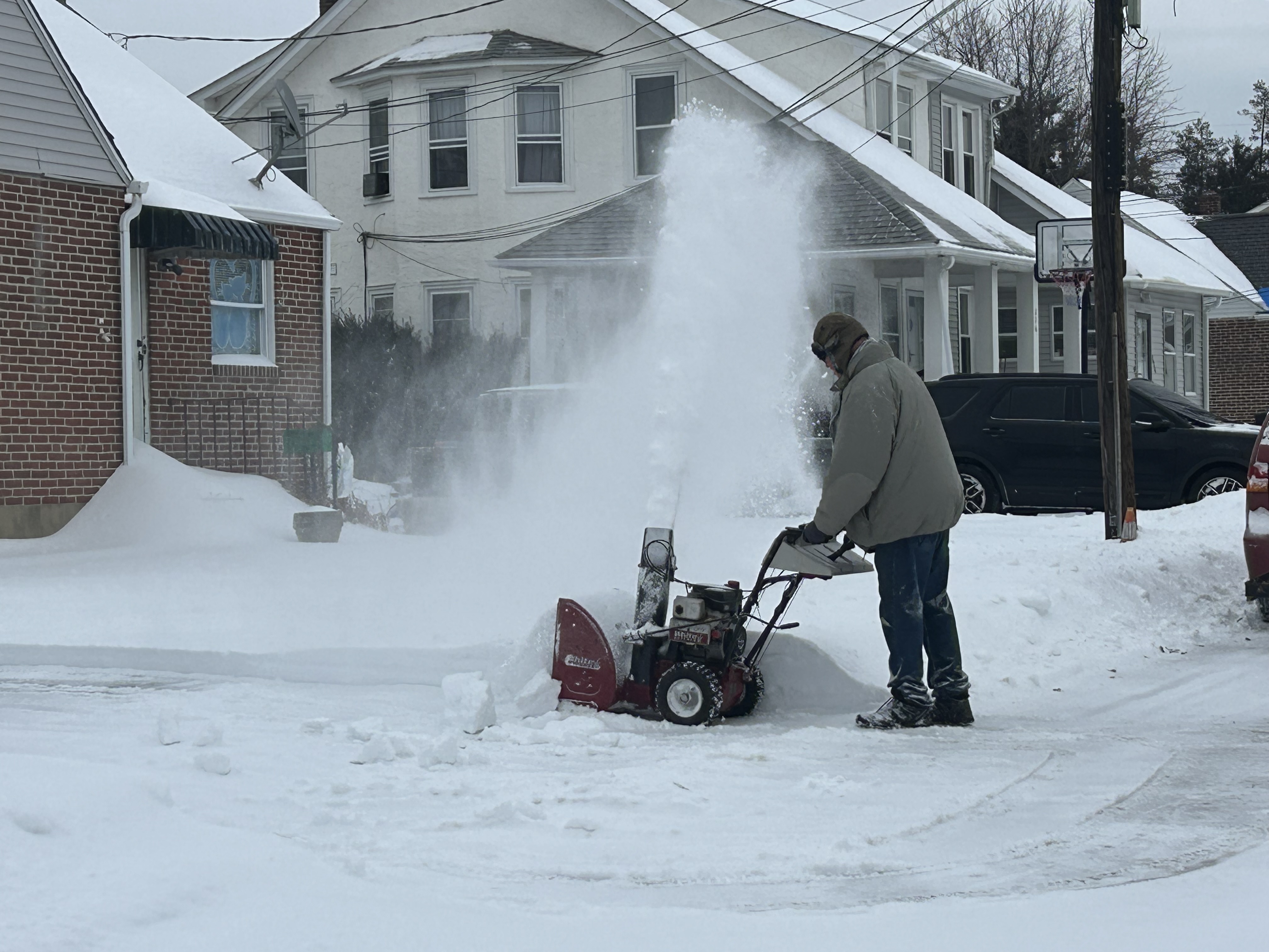 A Ridley Township man with a snow blower clearing his...
