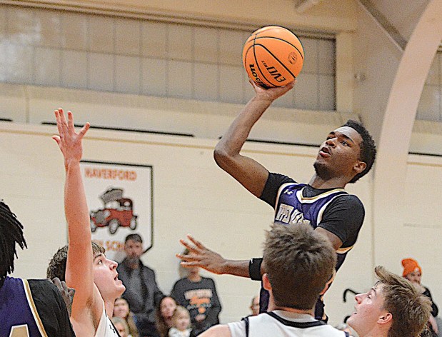 Upper Darby's Marlon Boreland puts up a shot against Marple Newtown in the first half Tuesday. (PETE BANNAN/MediaNews Group) 