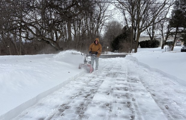 David Borden clearing his driveway in the 600 block of Brownsville Road in Lower Heidelberg Township on Monday, the day after a long winter storm. (STEVEN HENSHAW - READING EAGLE)