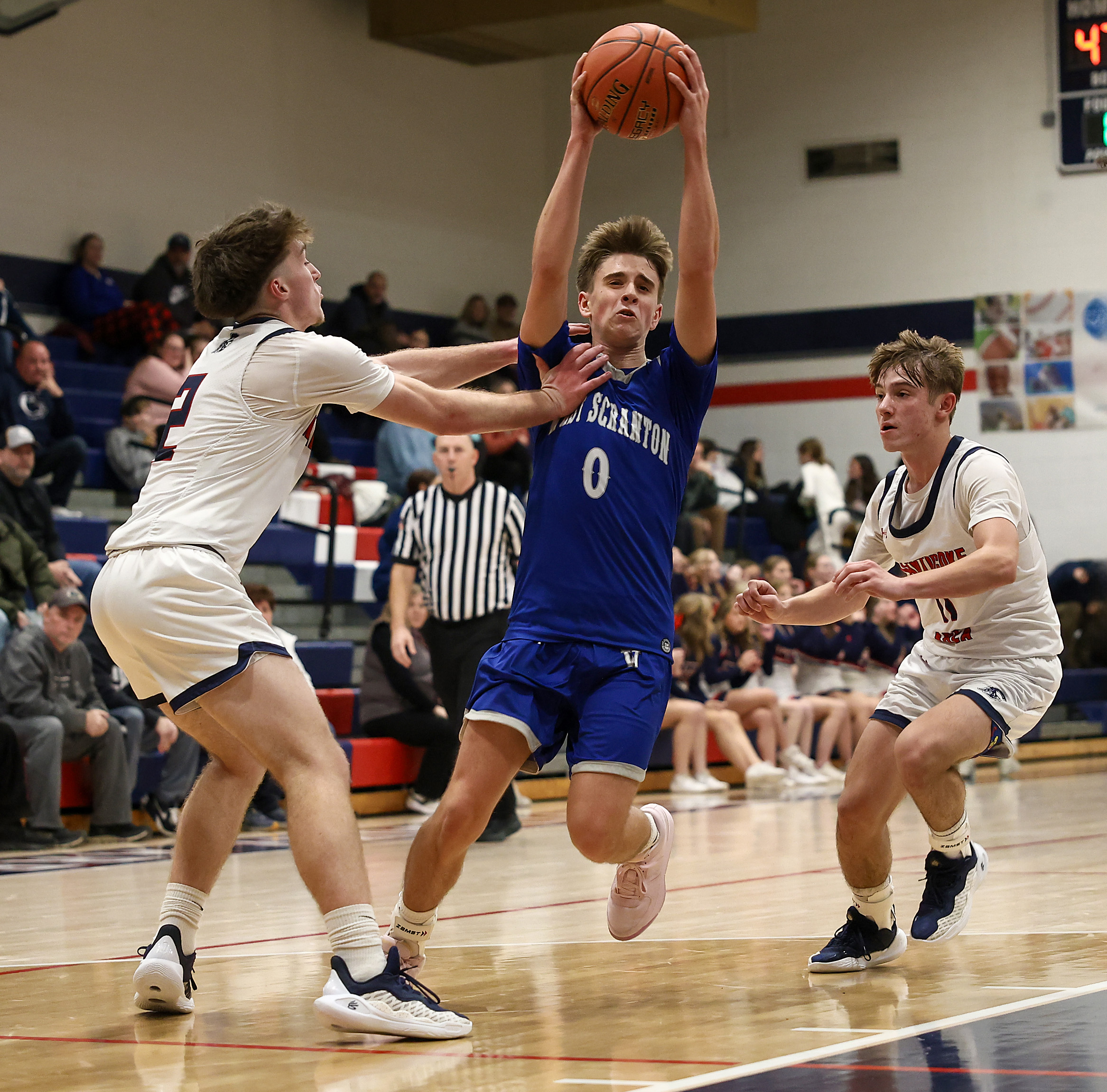 West Scrantonâs Nate Schimelfenig (0) drives the ball between two...