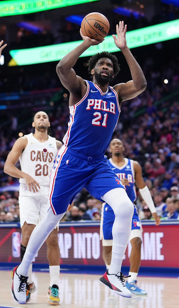 Philadelphia 76ers' Joel Embiid (21) goes up for a shot during the first half of an NBA basketball game against the Cleveland Cavaliers Wednesday, Jan. 14, 2026, in Philadelphia.