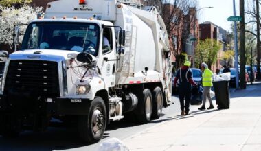 City of Philadelphia sanitation workers pickup trash with a garbage truck along the 1100 block of Lombard Street on Thursday, April 2, 2020.