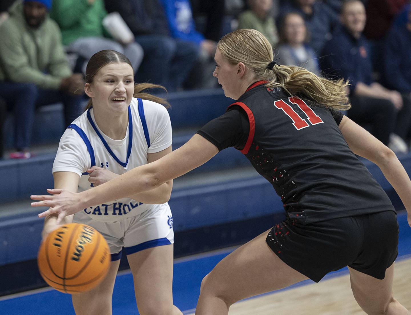Newman’s Veronica Haley makes a pass against Erie-Prophetstown’s Lauren Abbott Thursday, Jan. 29, 2026.