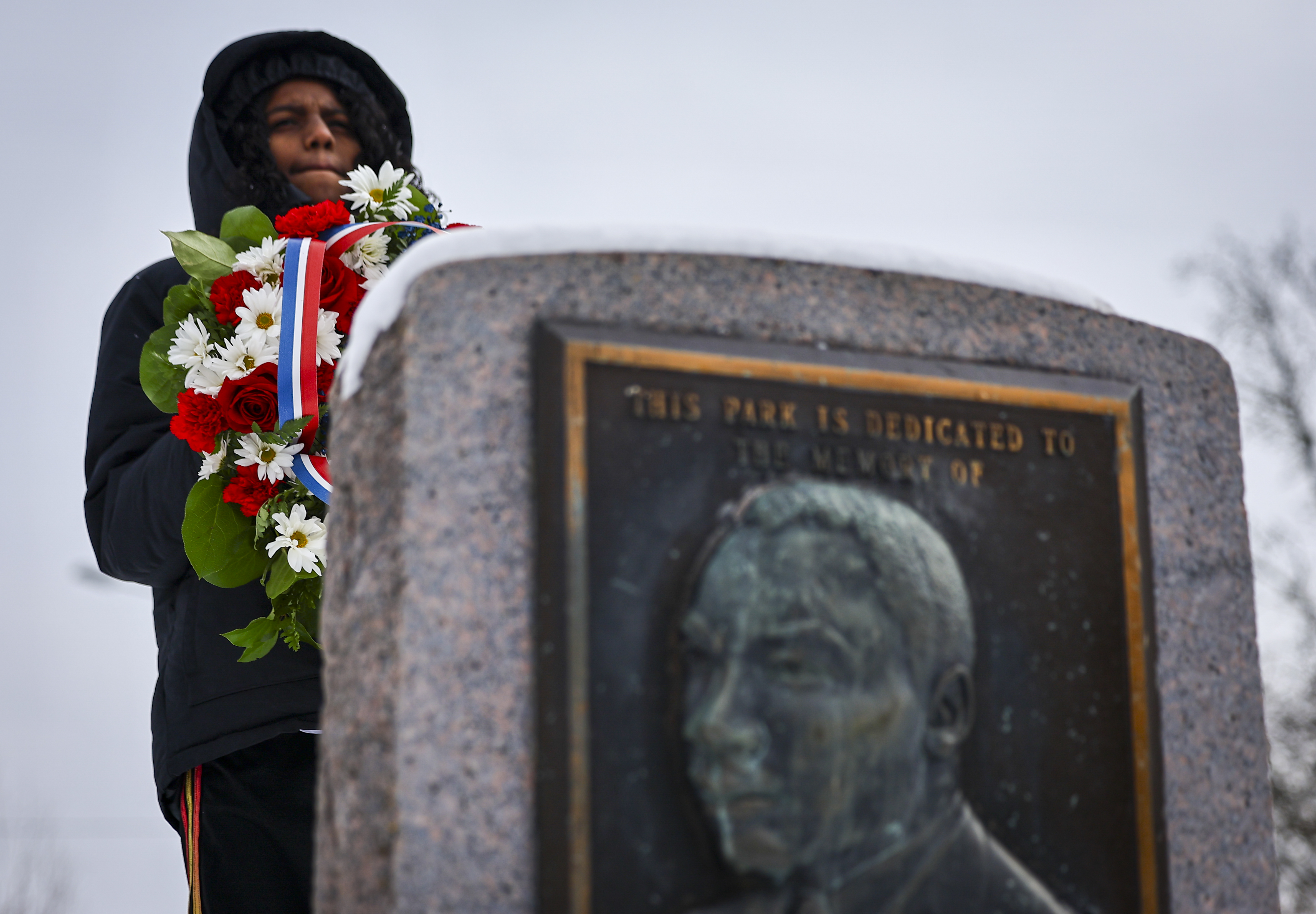 Jaxyn Rushing, 12, of Bethlehem, holds a wreath at Martin Luther King Park following the Civil Rights Movement March honoring Dr. Martin Luther King Jr. on Monday, Jan. 19, 2025, through Southside Bethlehem. 