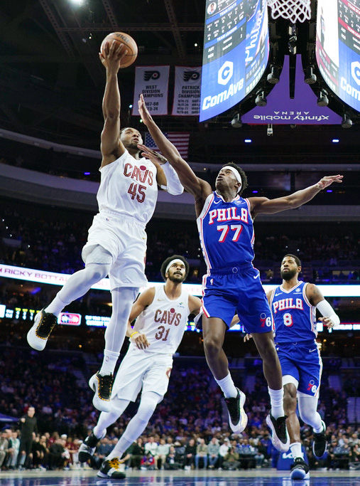 Cleveland Cavaliers' Donovan Mitchell (45) goes up for a shot against Philadelphia 76ers' Vj Edgecombe (77) during the first half of an NBA basketball game Wednesday, Jan. 14, 2026, in Philadelphia. 