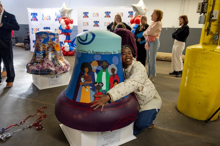 Tykira Octaviah, 27, of Northeast Philadelphia, Art Teacher and Independent Artist, taking a photo with their bell “Keeping it in the Family” during the Bells Across PA event in celebration of America’s 250th Birthday in Philadelphia, Pa., on Friday, Jan. 16, 2026.