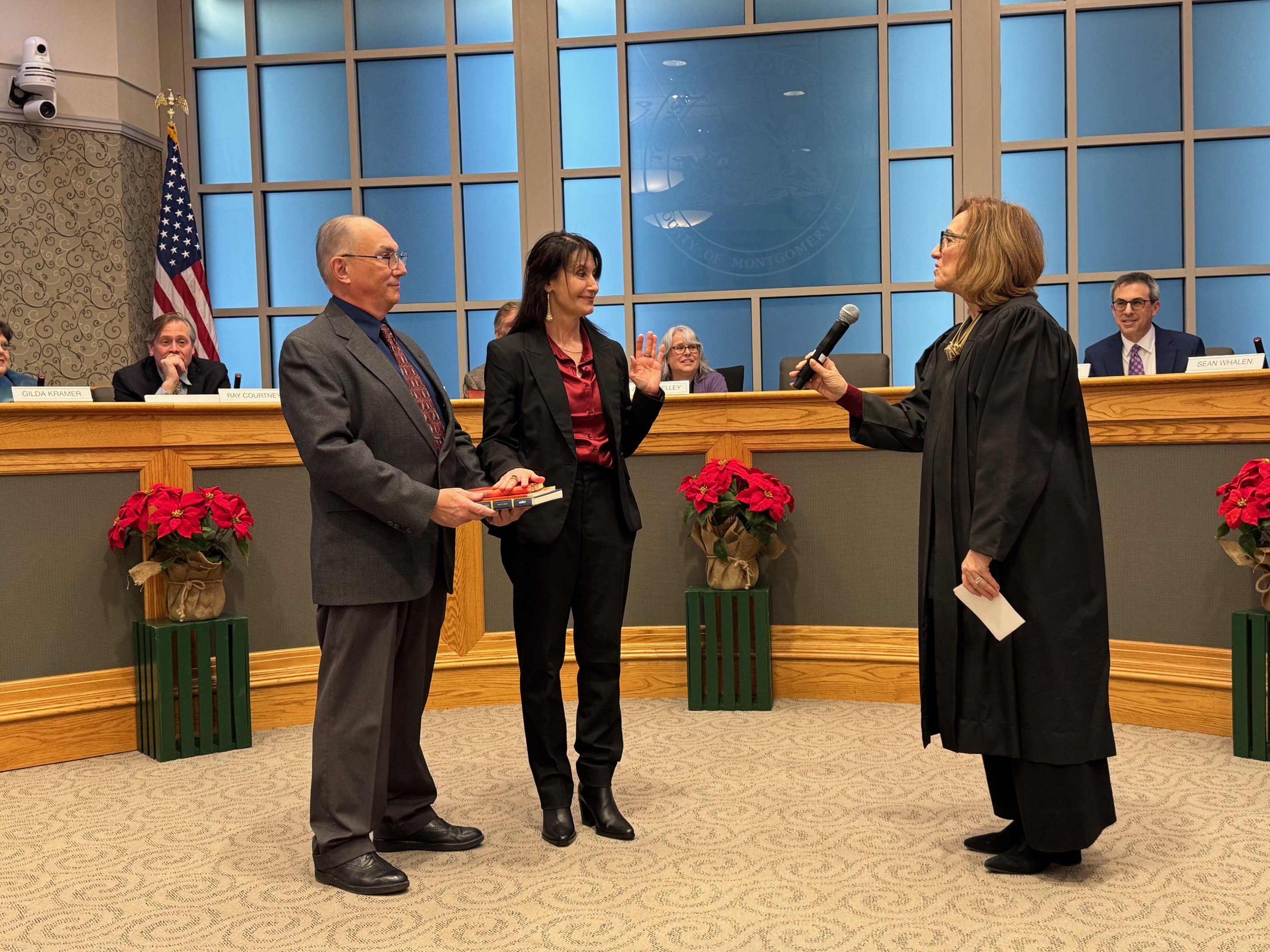 Chris McGuire being sworn in as Commissioner in Ward 6...