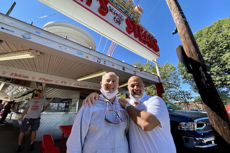 Pat's King of Steaks owner Frank E. Olivieri (right) and his father, Frank P. Olivieri, outside the stand on Sept. 21, 2020.