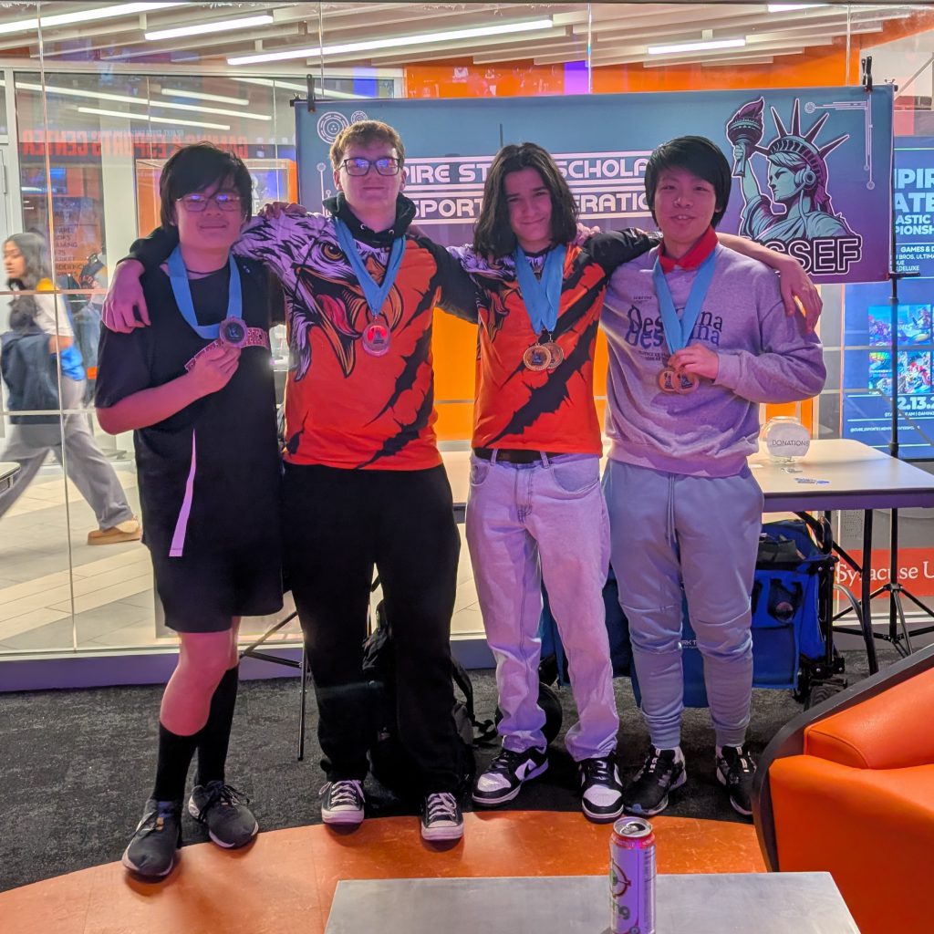 students displaying medals