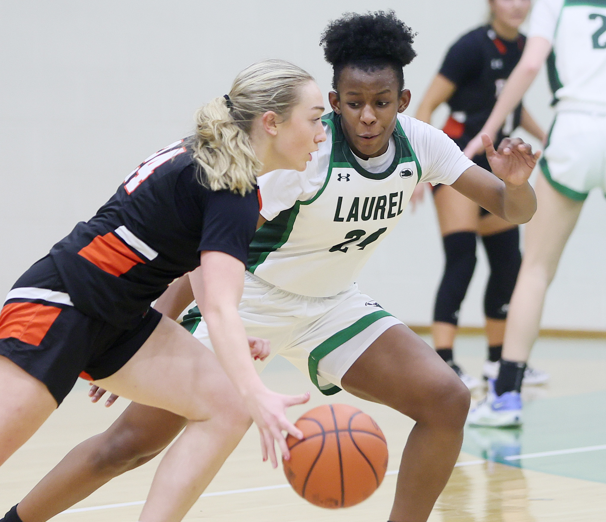 Laurel's Tristan Williams guards Cathedral Prep's Mia Washburn with aggressive defense in the second half. 