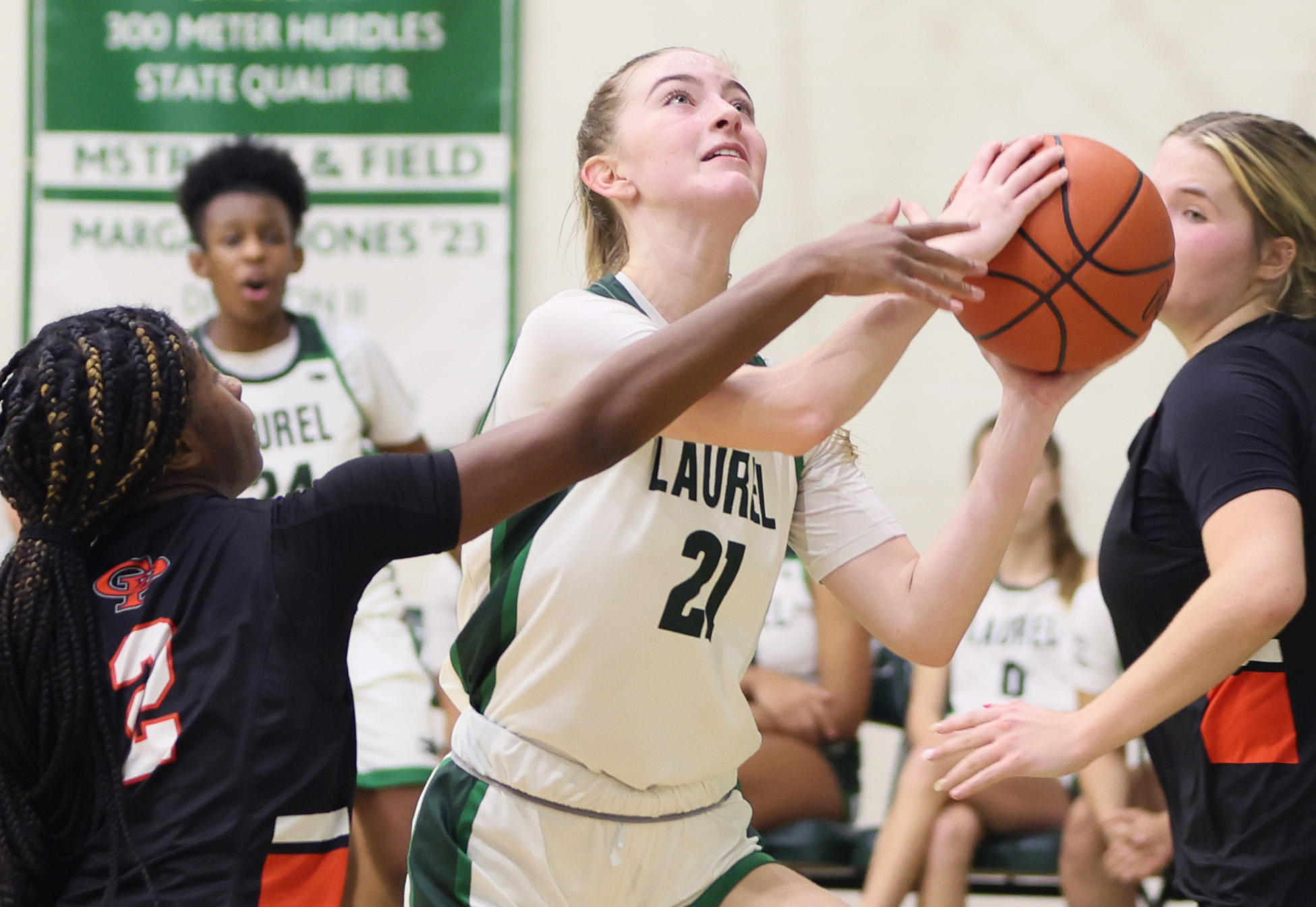 Laurel's Liv Schneider drives to the basket guarded by Cathedral Prep's Seana Thrower in the second half.