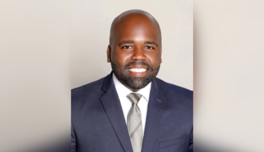 A headshot of Dr. Raynard Washington.