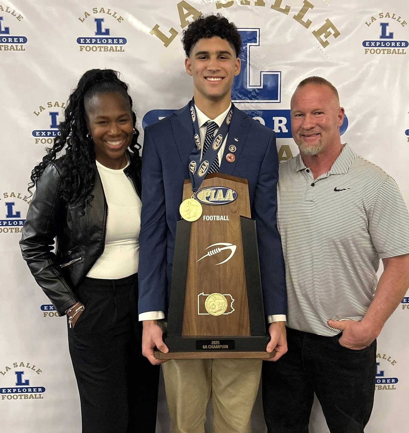 State champ Joey O’Brien, with proud folks Tishara and Joe...