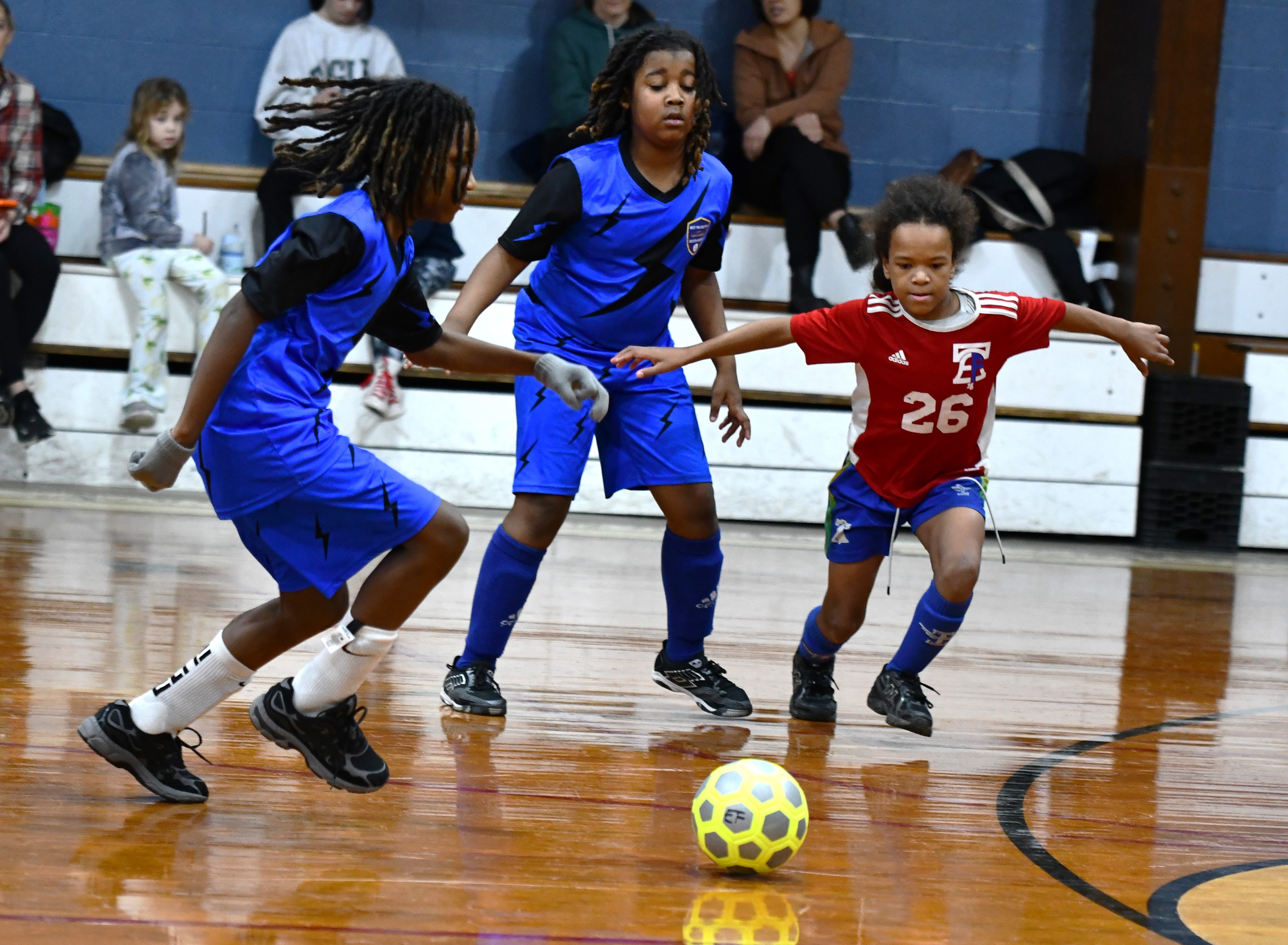 East Falls Mu Drayton looks to head off a West...