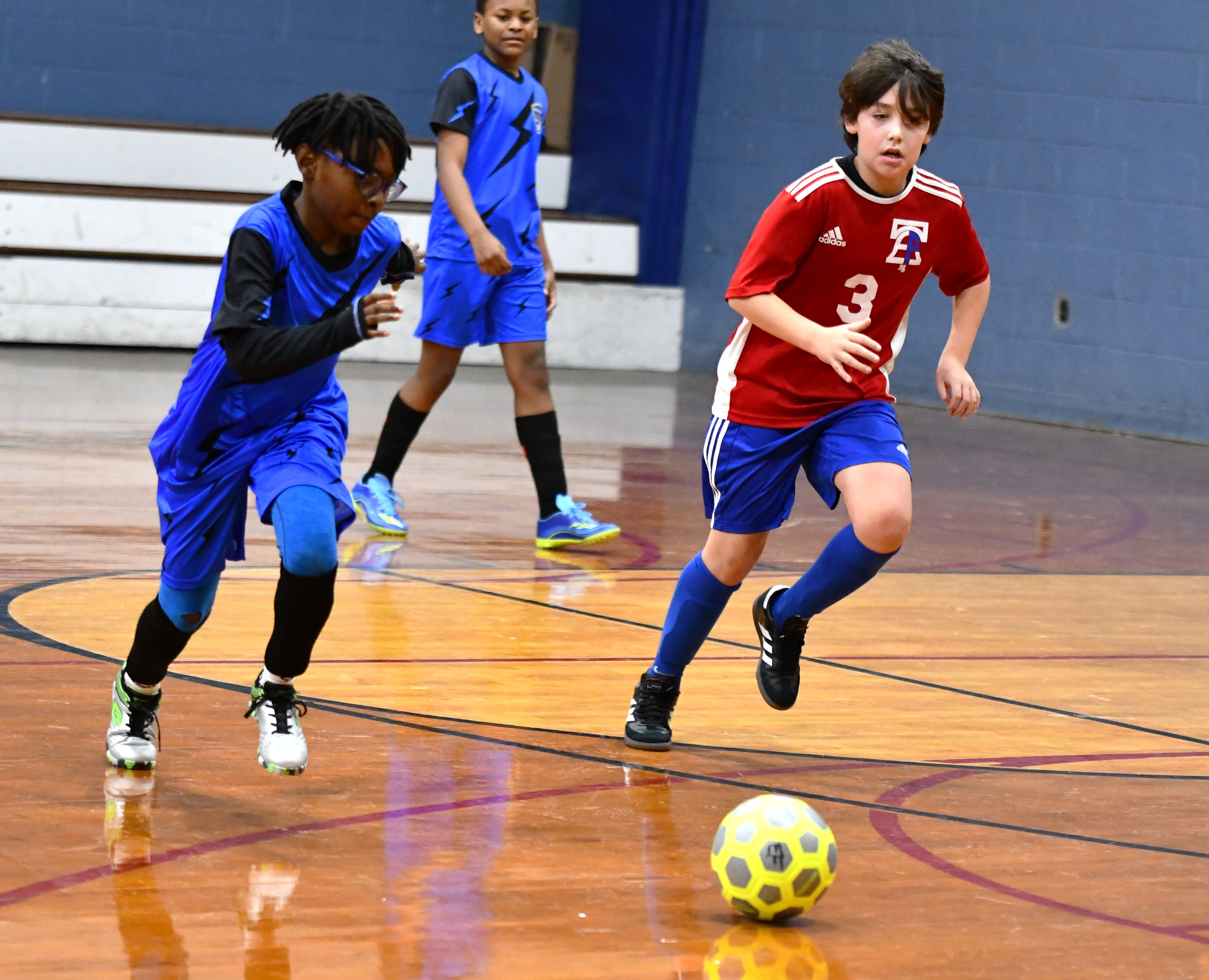 Hurricanes Prince-Zion Douglas has a foot race with Charlie Stein...