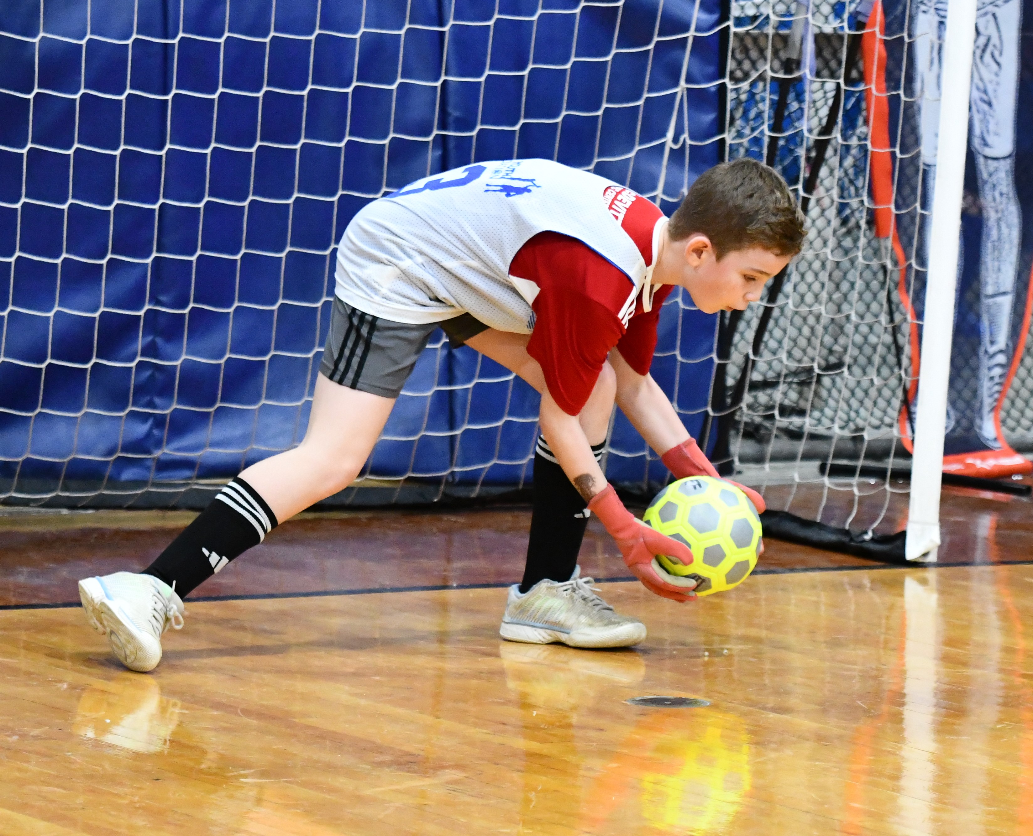 Rapids Joe Lewandowski scoops up the ball in the goal...