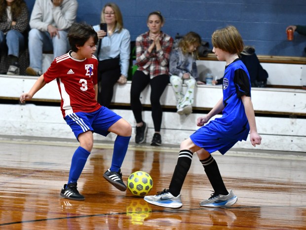 East Falls Charlie Stein and WP's Eli Shuster-Bechelli go toe to toe to try to gain possession. (Photo by Rick Cawley)
