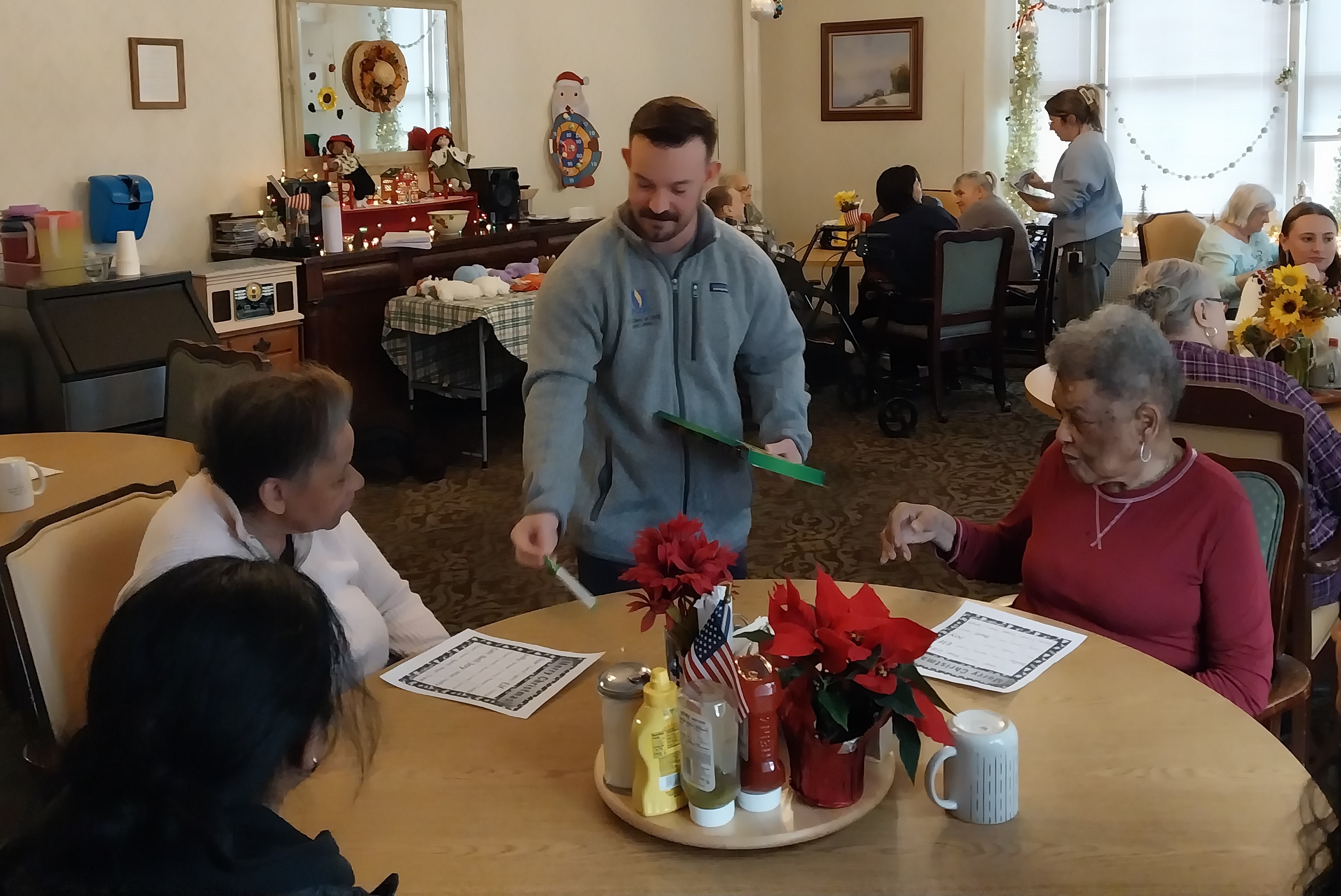 Volunteers from the PCOM Psychiatry Club help set the lasses...