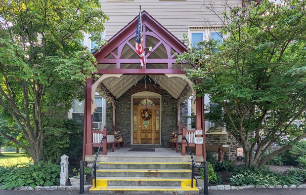 The idyllic front entrance harkens back to a glorious era of architecture and craftsmanship. (Photo courtesy of Roxborough Home for Women)