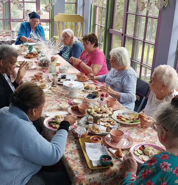 The Home encourages social interaction through a wide variety of activities such as the women's tea. (Photo courtesy of Roxborough Home for Women)