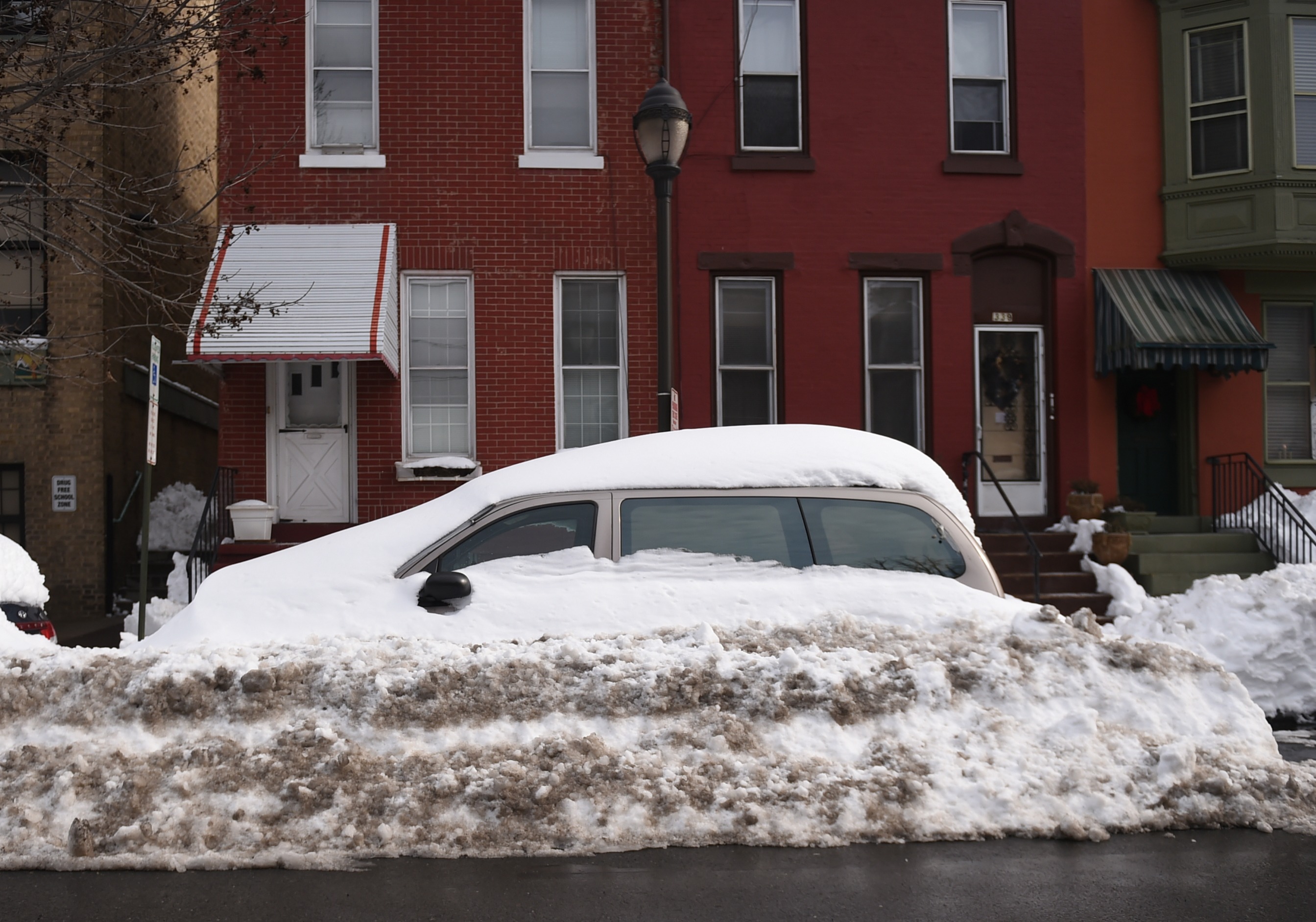 Plowed-in cars and excess snow remained a problem on South...