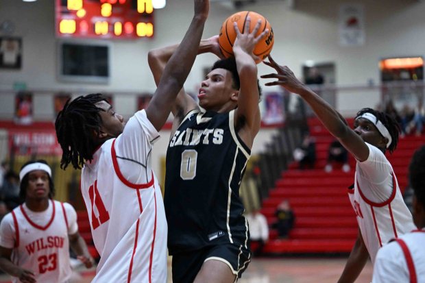 Berks Catholic's Carmelo Harper drives against Wilson in a 50-38 Saints' victory over the Bulldogs on Monday, Jan. 19, 2026, at West Lawn. (BILL UHRICH/READING EAGLE)