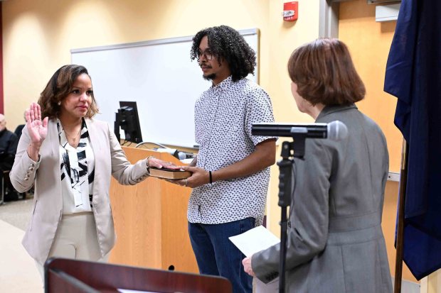 Reading City Clerk Linda A. Kelleher administers the oath of office to District 1 City Councilwoman Vanessa Campos whose brother Jesus Polanco is holding the Bible during an inauguration ceremony in the Schmidt Training and Technology Center at Reading Area Community College on Monday, Jan. 5, 2026. (BILL UHRICH/READING EAGLE)