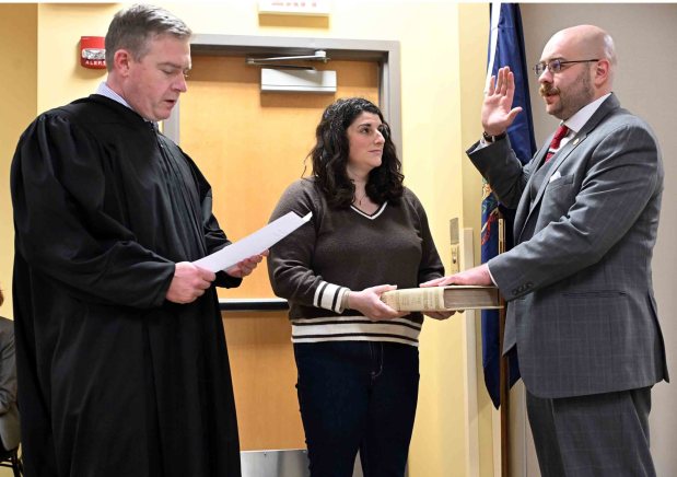 District 4 City Councilman Raymond E. Baker is administered the oath of office by Berks County Judge Justin Bodor as Baker's wife, Jennifer, holds the Bible during an inauguration ceremony in the Schmidt Training and Technology Center at Reading Area Community College on Monday, Jan. 5, 2026. (BILL UHRICH/READING EAGLE)