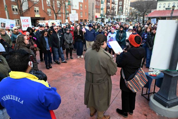 Patty Torres Vera, co-executive director of Make the Road Pennsylvania, and Rev. John Cullinan of the First Unitarian Universalist Church in Reading read a statement in English and Spanish written by Becca Good, the widow of Renee Nicole Good, during a community vigil in the 800 block of Penn Street on Sunday, Jan. 11, 2026. Over 300 mourners turned out to honor the memory of Renee Nicole Good, who was killed Jan. 7 by an Immigration and Customs Enforcement officer in Minneapolis. (BILL UHRICH/READING EAGLE)