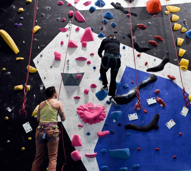 Krista Weller belays Nathan Creveling as he climbs down the wall during an IM ABLE foundation adaptive rock climbing session at Reading Rocks Climbing and Fitness, 550 George St., Muhlenberg Township. (BILL UHRICH/READING EAGLE)