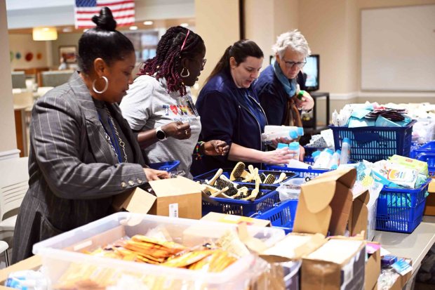 Reading Hospital staff members prepare items to place in backpacks during a Martin Luther King Jr. Day of Service on Monday, Jan. 19, 2026. The backpacks will be handed out to the homeless visited by the hospital's Street Medicine Team. (Bill UHRICH/READING EAGLE)