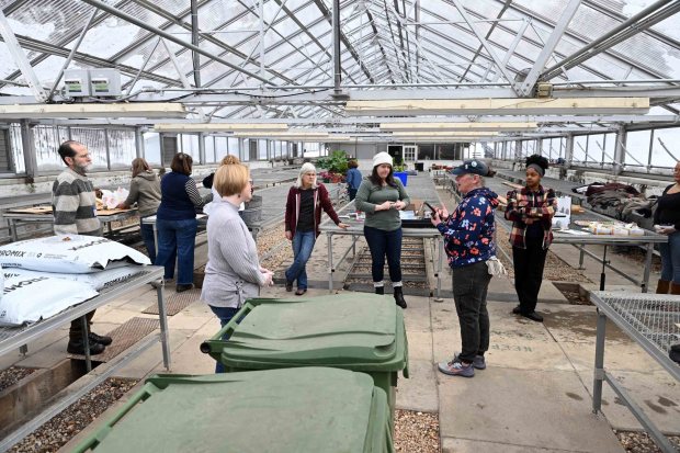 Bethany Ayers Fisher, sustainability manager for the city of Reading, talks with community volunteers before starting a seed-planting event at the City Park Greenhouse during a Martin Luther King Jr. Day of Service on Monday, Jan. 19, 2026. (Bill UHRICH/READING EAGLE)