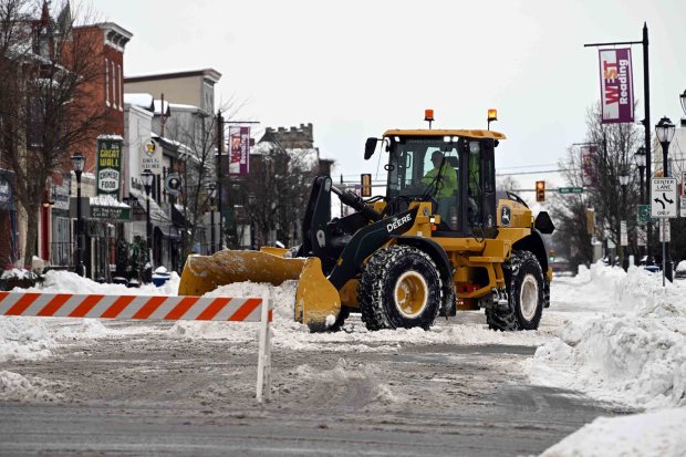 Crews clear snow from the 500 block of Penn Avenue in West Reading on Monday, Jan. 26, 2026. (BILL UHRICH/READING EAGLE)