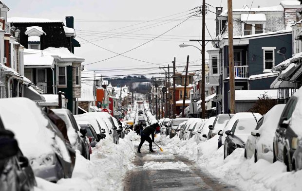 Residents dig out their cars on Mulberry Street on Monday, Jan. 26, 2026.   (BILL UHRICH/READING EAGLE)