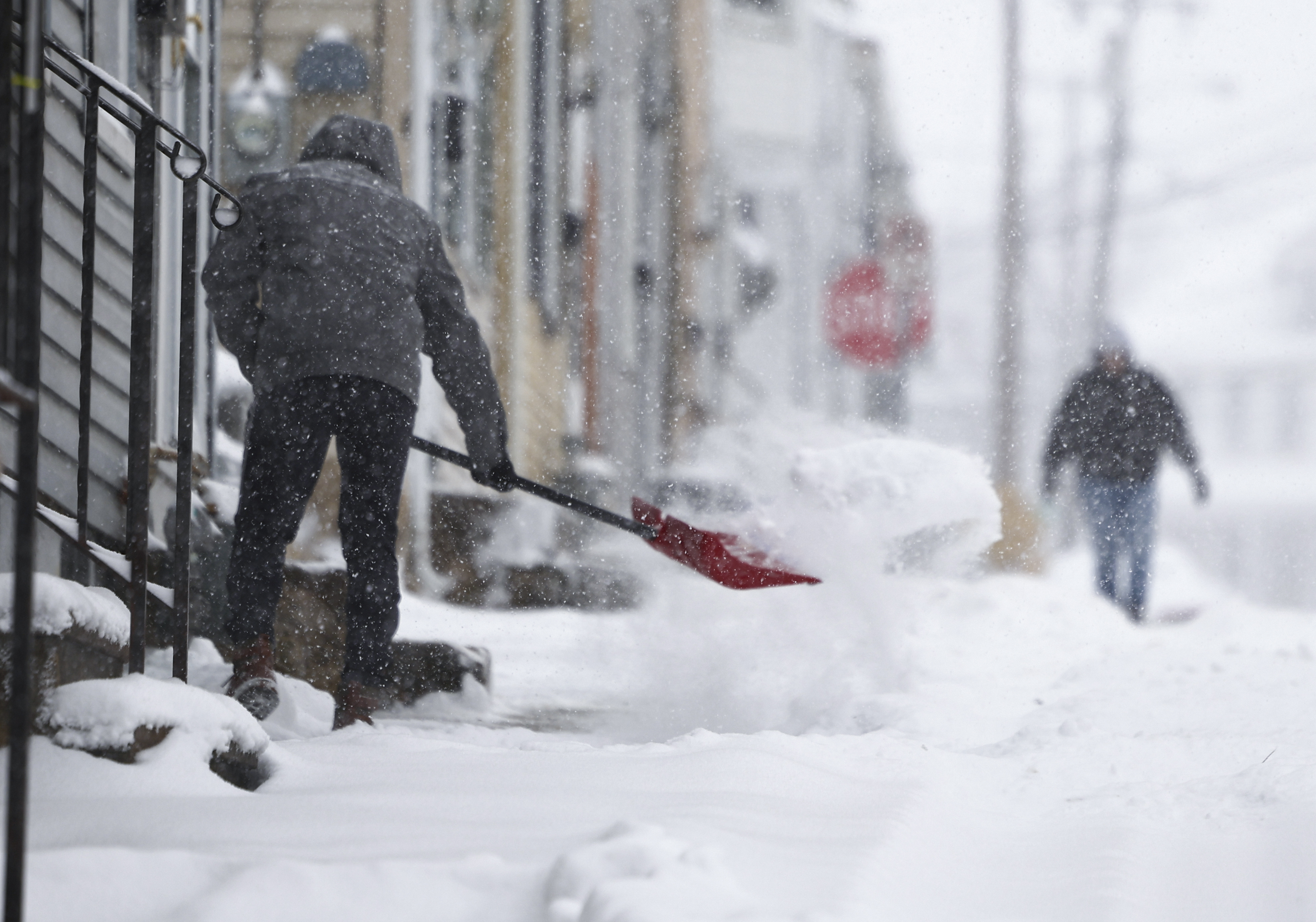 People get an early jump shoveling outside their homes around 10:30 a.m. on Pearl Street in Easton on Sunday, Jan 25, 2026. 