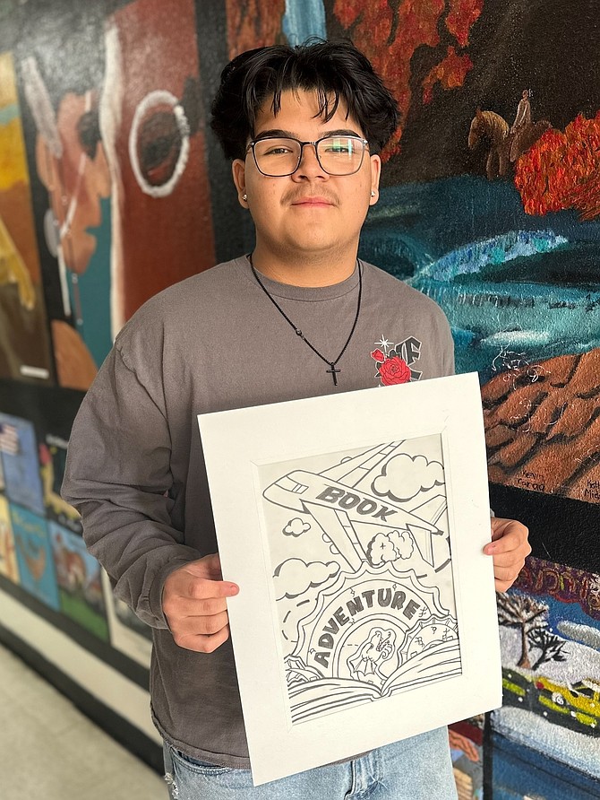 Carson High School sophomore Kevin Mariscal displays his artwork that won honorable mention in the 2025 Nevada Reading Week Art Contest.