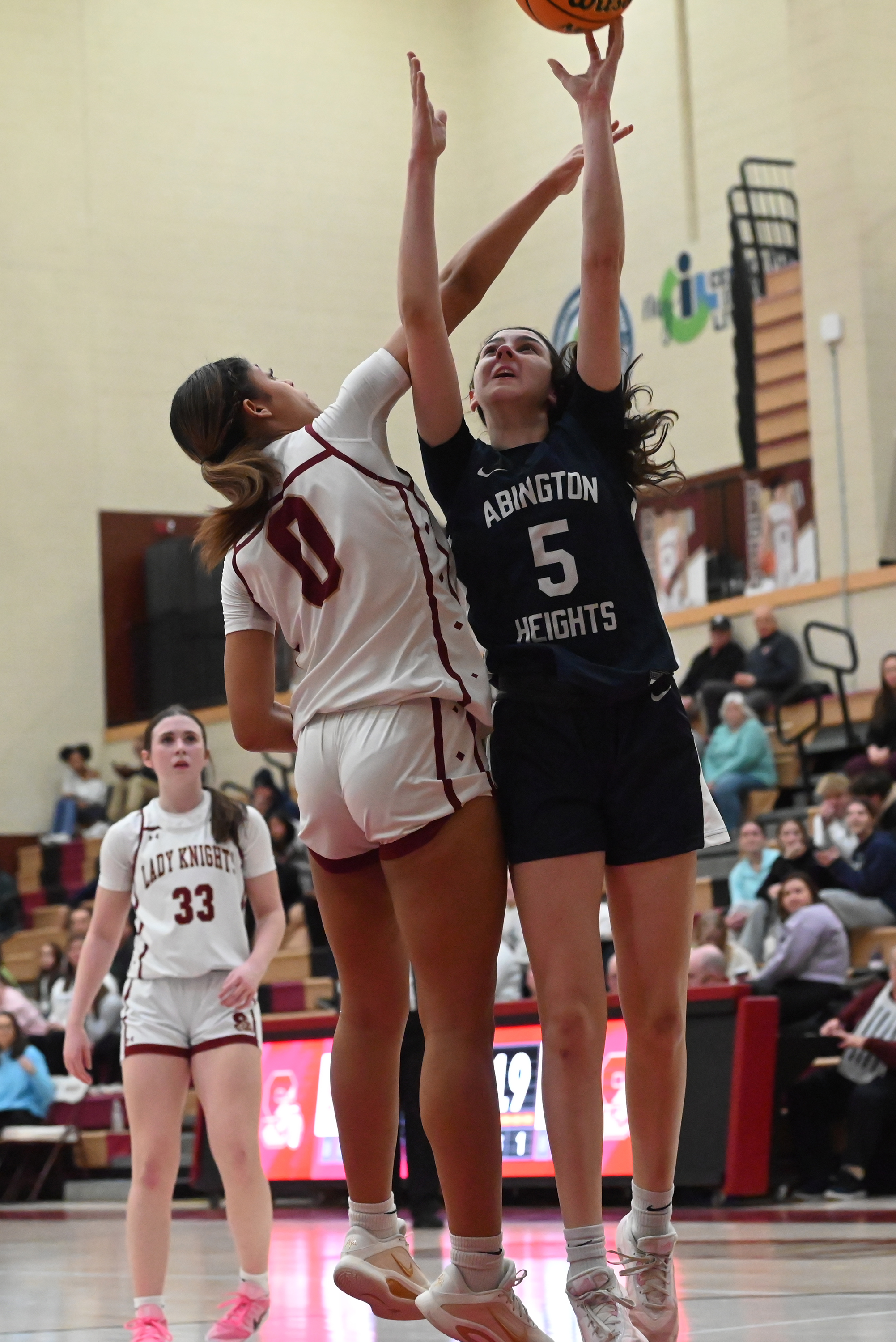 Scranton’s Kori Ortiz tries to block Abington Heights’ Emma Coleman...