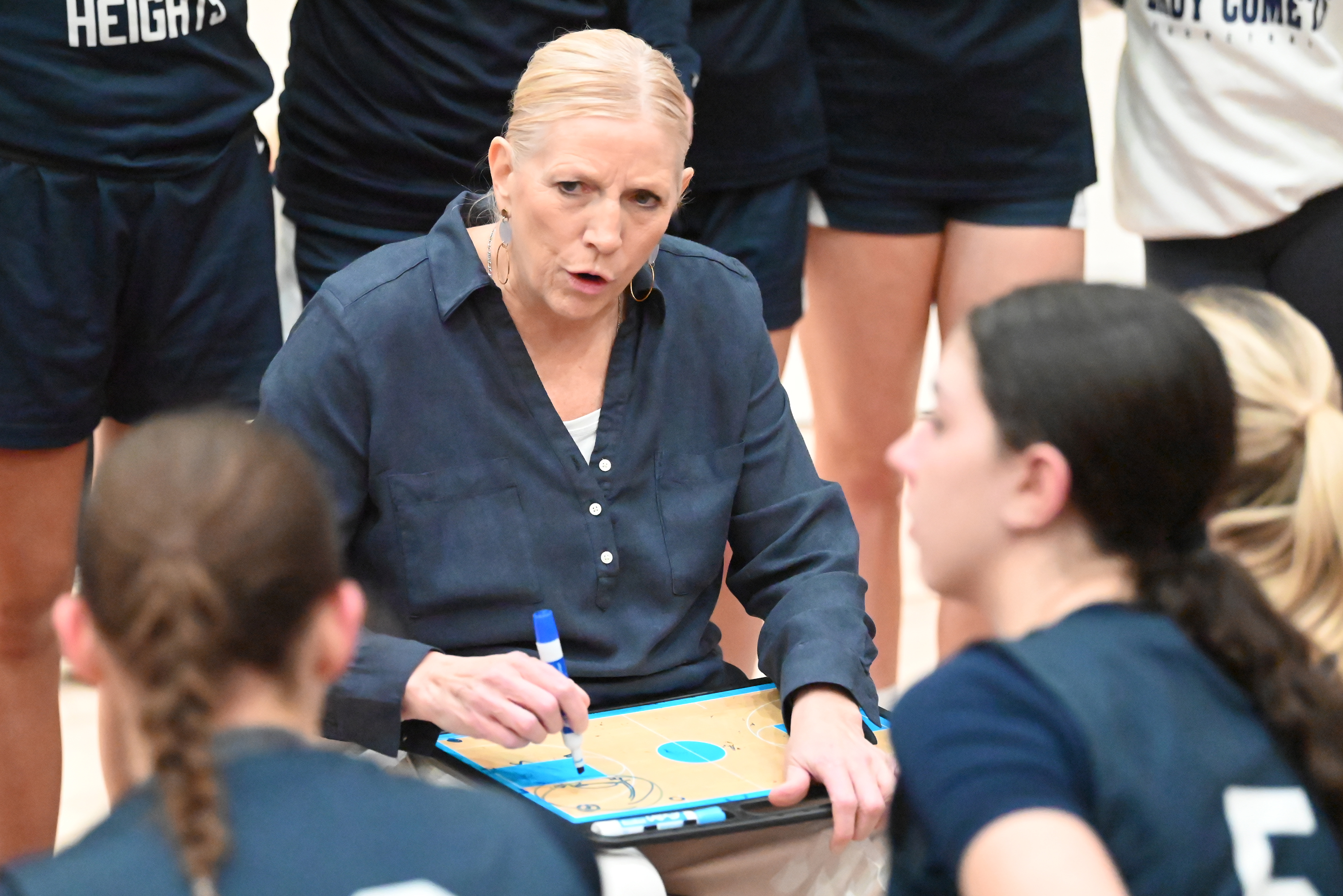 Abington Heights’ head coach Deanna Klingman talks to her players...