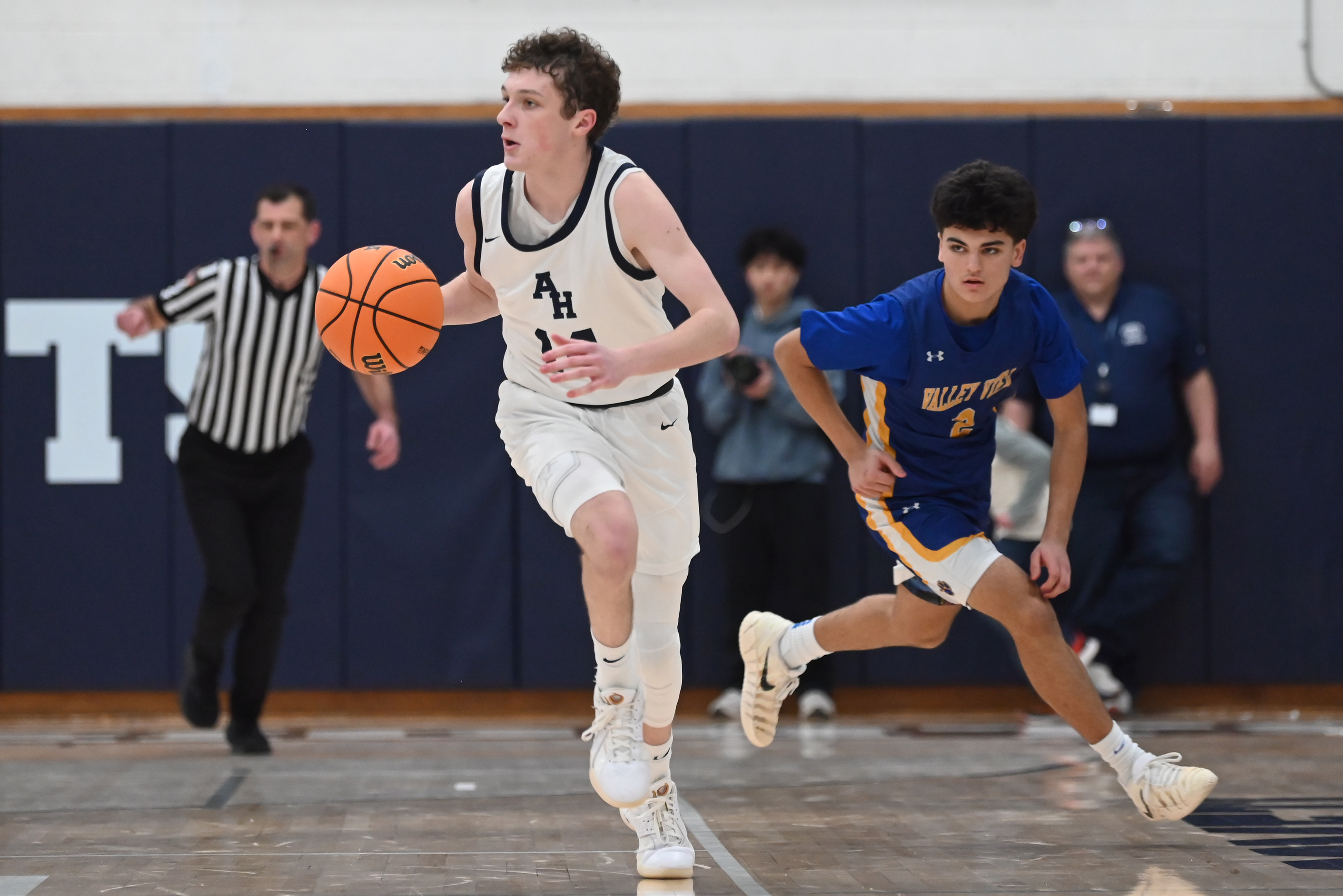 Abington Heights’ Andrew Kettle moves the ball during the basketball...