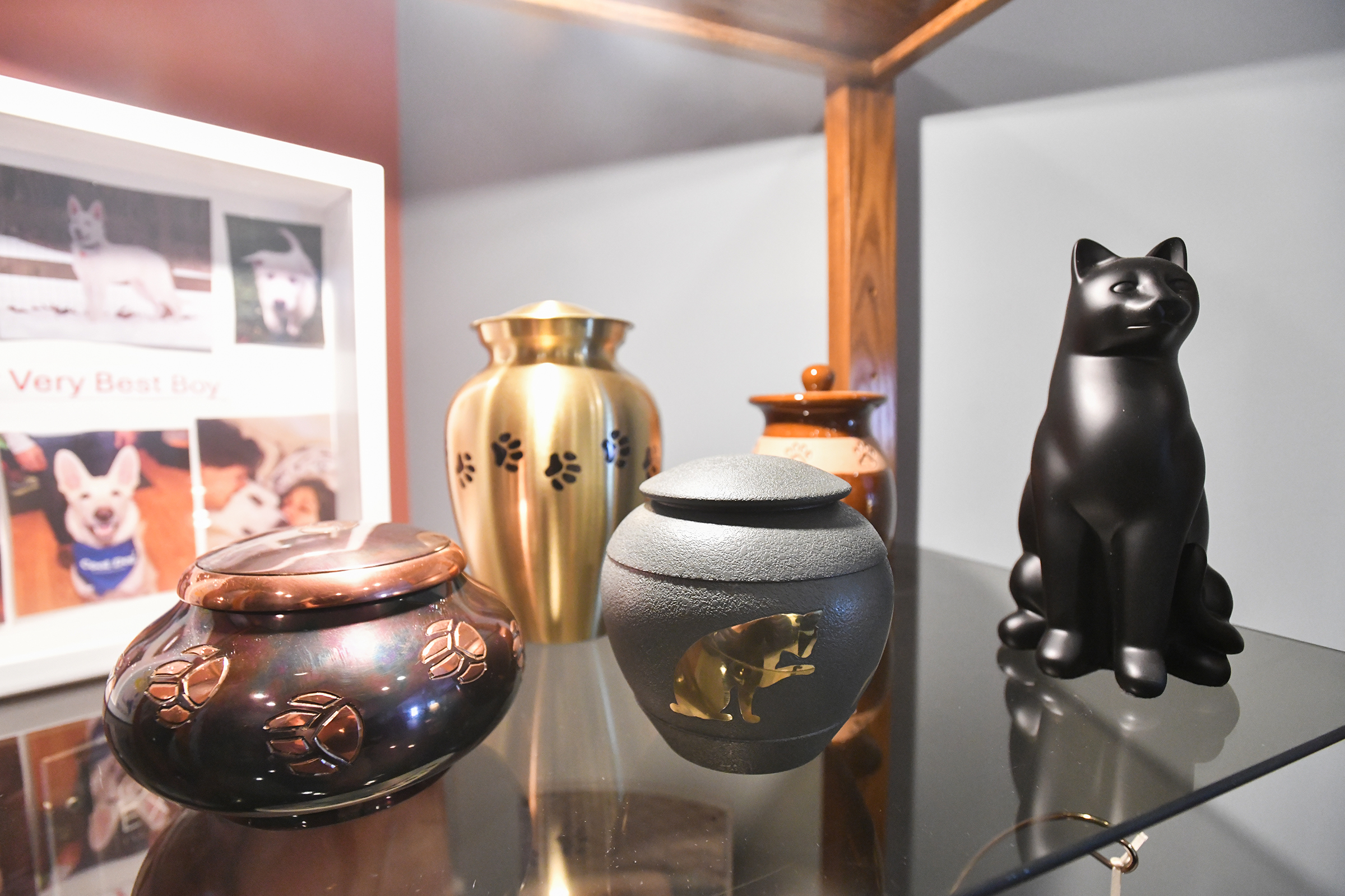 Various urns used for pet remains are for sale in...