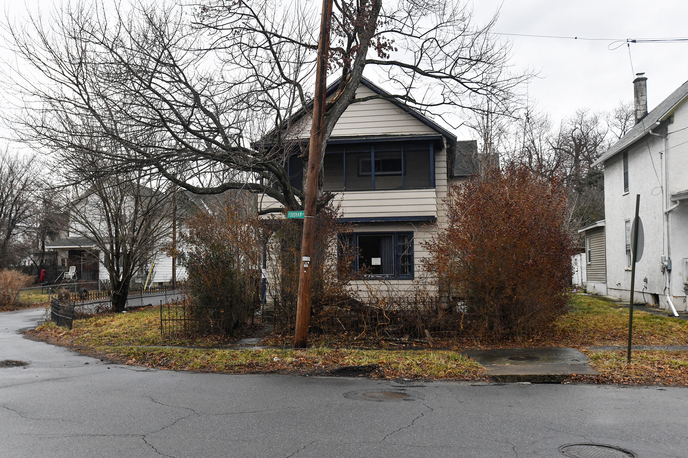 A blighted property sits condemned at 25 New York St....
