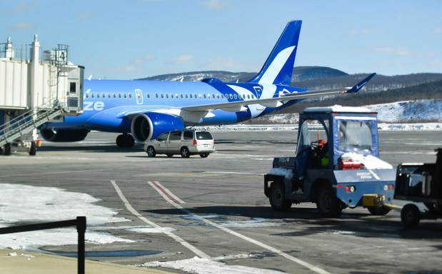 A baggage tractor is on its way to load luggage onto a Breeze Airways flight before departing to Fort Myers, Fla., from the Wilkes-Barre Scranton International Airport in Pittston Twp. Friday, January 30, 2026. (SEAN MCKEAG / STAFF PHOTOGRAPHER)