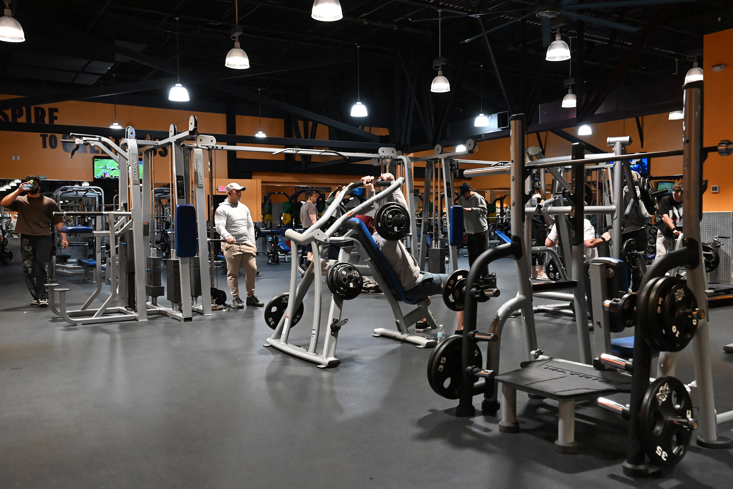 Community members work out at the Crunch Fitness in the...