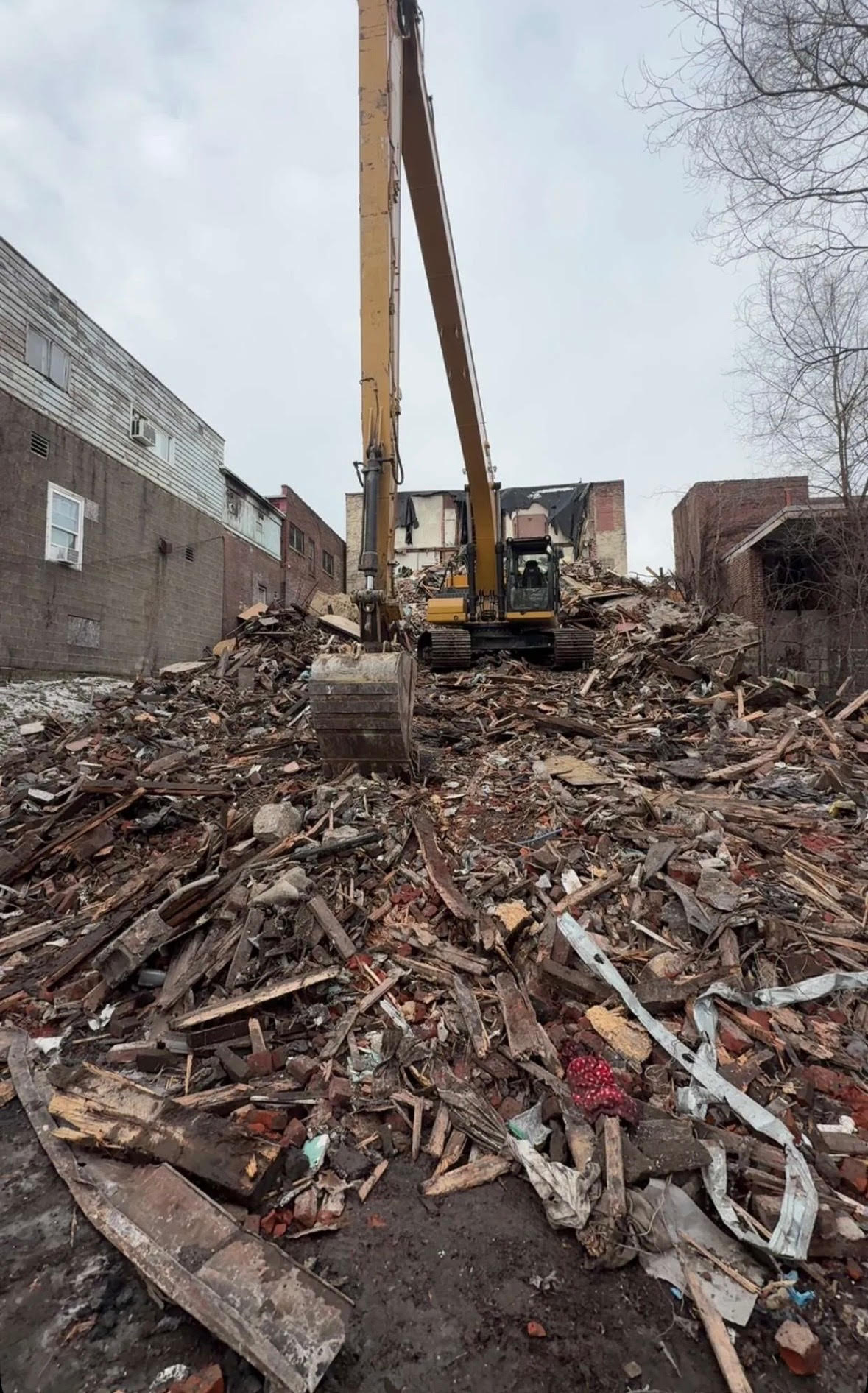 Crews from RLE Enterprises demolish a portion of the West...