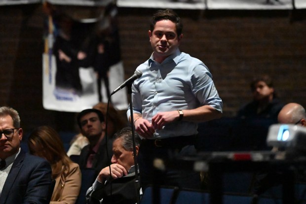 State Rep. Kyle Mullins steps up to the mike to ask DEP and the developer's representatives questions during the hearing for the proposed Project Gravity data center campus at Valley View High School on Tuesday, Jan. 06, 2026. (REBECCA PARTICKA/STAFF PHOTOGRAPHER)