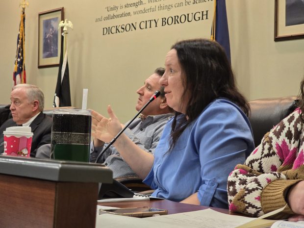 Councilwoman Casey Sims questions the impacts of cutting down trees along the mountain and the possibility of runoff during a public hearing Tuesday, Jan. 20, 2026, in the Dickson City Borough Building. (FRANK WILKES LESNEFSKY / STAFF PHOTO)