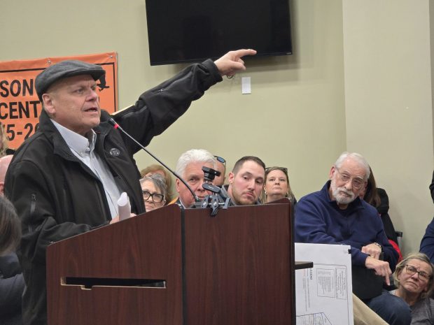 Bell Mountain resident Tim Pfleiderer questions the impacts a 403-acre data center overlay would have on his home during a public hearing Tuesday, Jan. 20, 2026, in the Dickson City Borough Building. (FRANK WILKES LESNEFSKY / STAFF PHOTO)